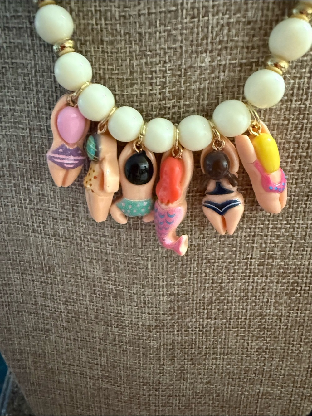 White Beaded Necklace with Gold Accents and Multicolor Swimmer Charms - Picture 8 of 10